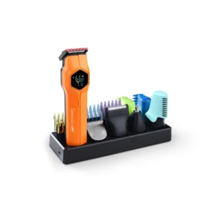 Kit profesional de barbería con la máquina cortadora ElectroBell Pro modelo Fusion EB-577 en color cobre metalizado. Se muestra la máquina junto a su set de 12 piezas que incluye peines guía, aceite, brocha de limpieza y peine de mano, todo frente a su empaque original negro y dorado que destaca 'Fusion Clipper' y '12 Piece Haircut Kit'.