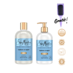 Presentación del kit Shea Moisture Manuka Honey & Yogurt Hydrate & Repair. Se observan dos frascos transparentes que dejan ver el producto color crema, decorados con llamativas etiquetas azul claro y tapas doradas (Champú con tapa rosca y Acondicionador con bomba). Acompañado de un cepillo morado con la palabra Gratis en manuscrita y emblemas dorados que garantizan un producto vegano, libre de crueldad, sulfatos y parabenos.